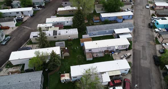 Run down single and double wide trailers in a mobile home park showing wealth disparity in 2021.