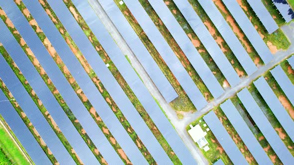 Drone fly over solar farm, renewable energy from solar.