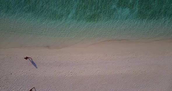 Natural drone copy space shot of a white sandy paradise beach and aqua blue ocean background in hi r