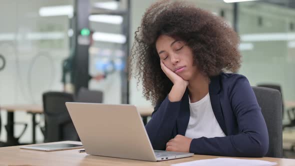 Sleepy Young African Businesswoman with Laptop Having Nap