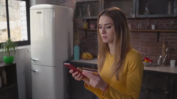 Young Lady Buying Via Internet in House