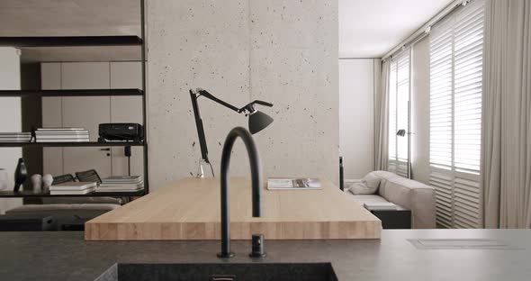 Modern Dining Area of Natural Wood Minimalist Apartment with Lamp Black Faucet