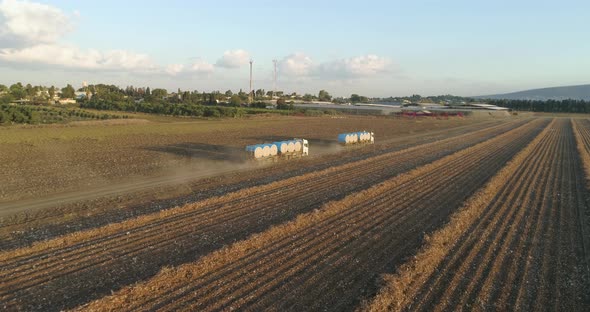 Aerial view of lorries in a cotton field, Israel.