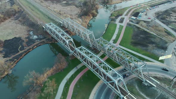 Highspeed train track, aerial top down view. Straight railway across river