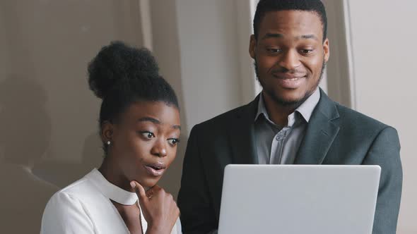 Focused Male Mentor Manager Instruct Female Trainee Consult Client Explain Computer Project