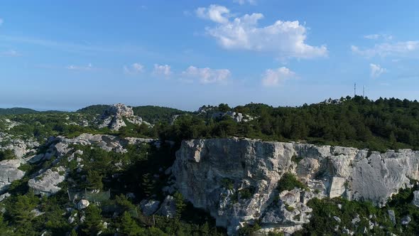 Cave dwellings of the Alpilles massif in France seen from the sky