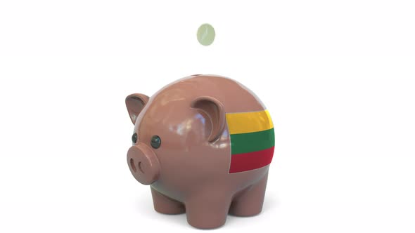Putting Money Into Piggy Bank with Flag of Lithuania