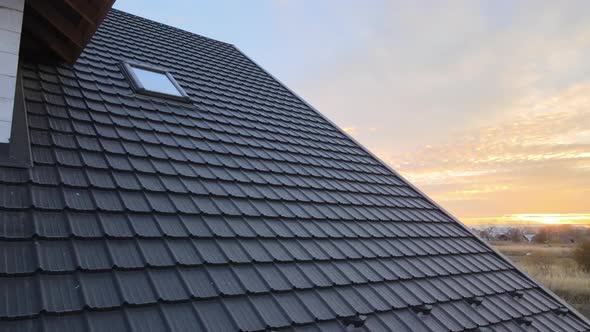 Closeup of House Roof Top Covered with Metallic Shingles