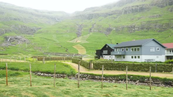 Old Faroese House with Grass Rooftop in the Middle of Mist Nature