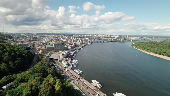 Aerial View of Metropolis By River with Skyscrapers Highway and Car Traffic