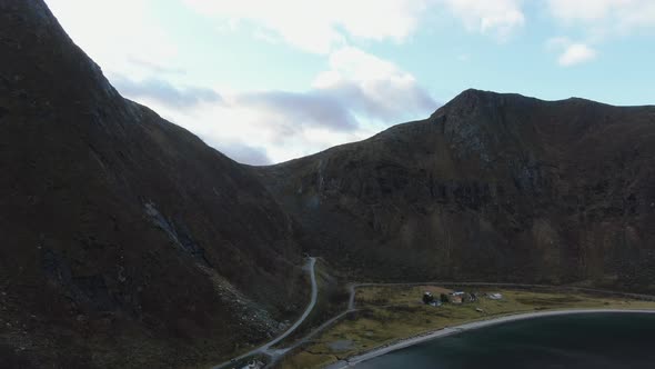 Drone Over Mountains And Fjord Under Blue Sky