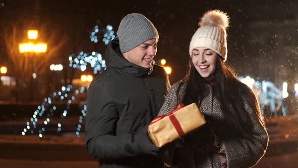 Young Romantic Couple is Having Fun Outdoors in Winter Before Christmas