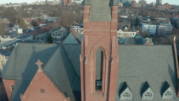 Aerial Drone Shot Ascending Next to a Brick Church Steeple in Suburban Boston