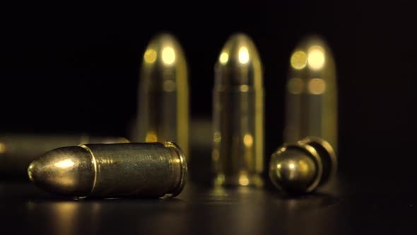 Closeup on Bullets on a Black Table