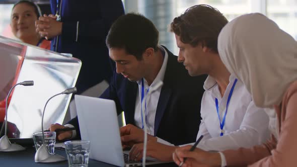 Business delegates talking at a conference