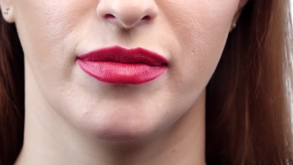 Close Up of a Woman Lips with Finger Asking for Silence, Closeup