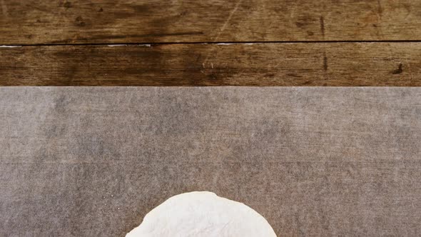 Dough ball pressed on butter paper 4k