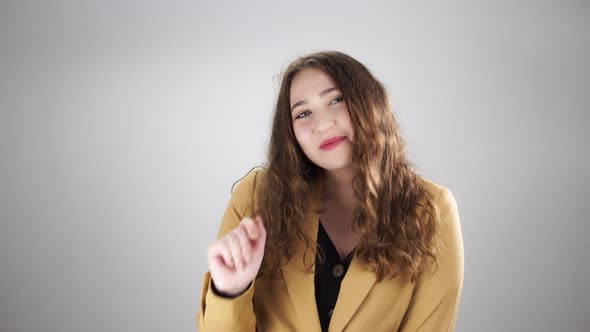 Isolated Portrait of Young Pretty Woman Showing Ok Sign By Fingers and Smiling on a White Background