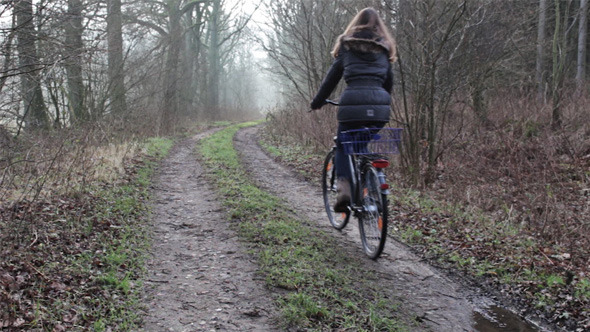 Girl on Bicycle - Foggy Forrest Track