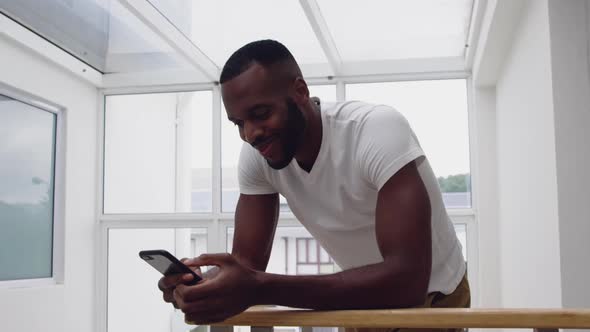 Young adult mixed race man enjoying time at home