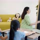 The tutor is teaching students in tutorial school, she is teaching basic English to Asian children. - VideoHive Item for Sale