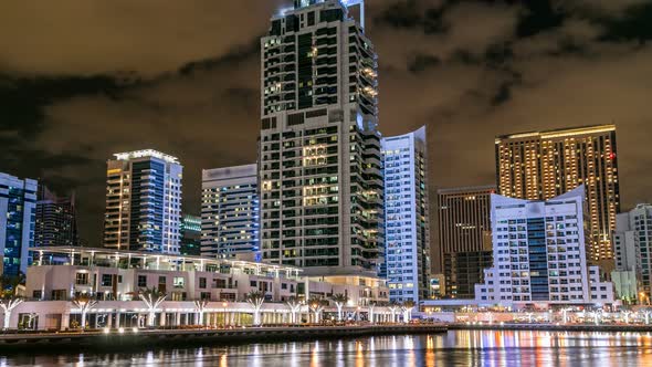 View of Dubai Marina Towers and Canal in Dubai Night Timelapse