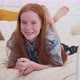 Happy Ginger Girl Smiling on Cozy Bed at Home - VideoHive Item for Sale