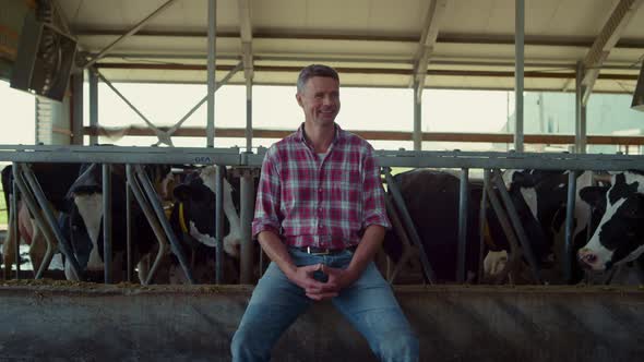 Happy Farmer Sitting Cowshed Feeder