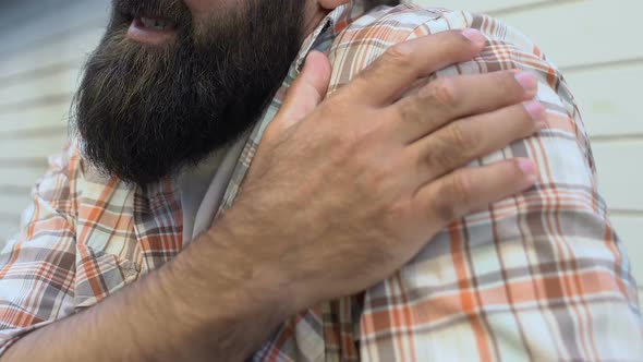 Tired Male Worker Exercising to Relieve Shoulder Pain, Joint Health Problems