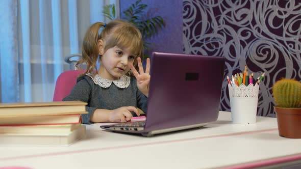 Girl Doing Online Homework with Teacher Using Digital Laptop Computer at Home Distance Education