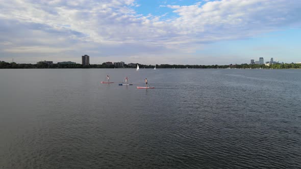 Paddelers at Lake Calhound Minneapolis during summer time. summer water activities