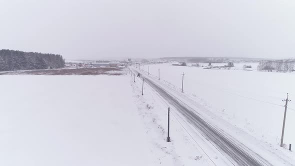 Aerial view of the grader is going to remove the snow 01