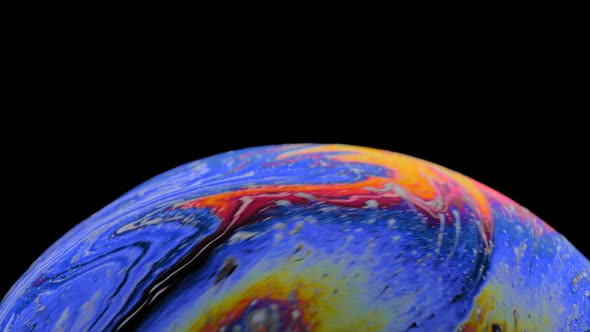 Multicolored Rainbow Colors of a Single Soap Bubble That Looks Like a Fantasy Planet Isolated