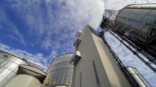 Modern warehouse. Grain elevator outdoors. Agricultural complex for grain processing.