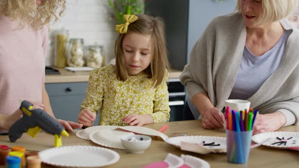 Handheld video of little girl makes an Easter bunny. Shot with RED helium camera in 8K.