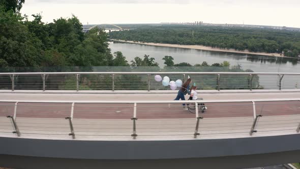 Cheerful Birthday Ride on Wheelchair, Girl and Mom