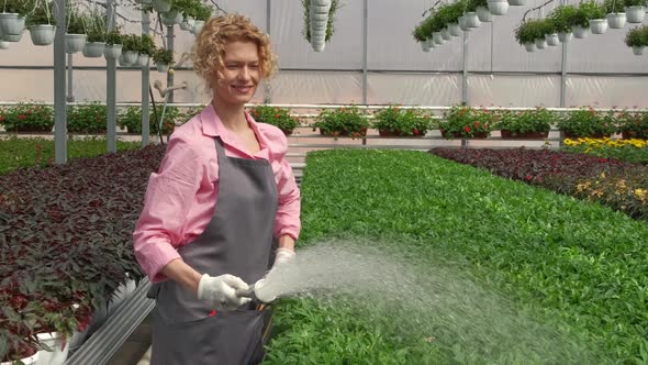 Blonde Woman is Happy to Watering and Care for Flower Seedlings