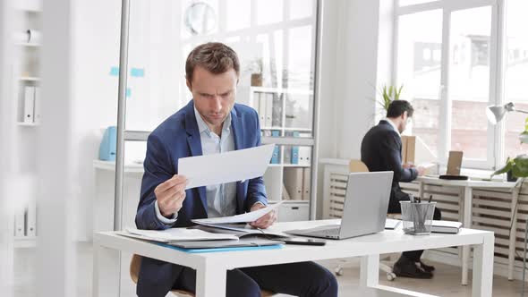 Office Worker Looking through Documents