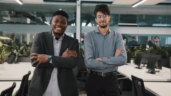 Multiracial Couple of Business Colleagues Smiling Diverse Coworkers Arabian Young Man African