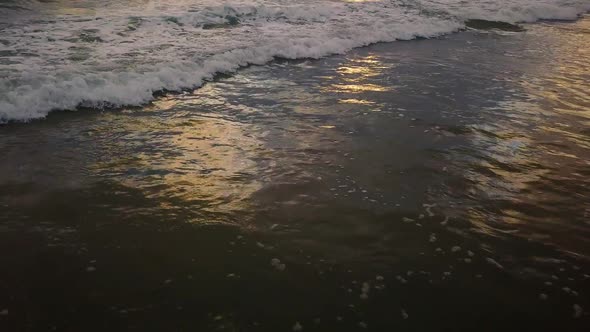 View of wave rolling to towards beach