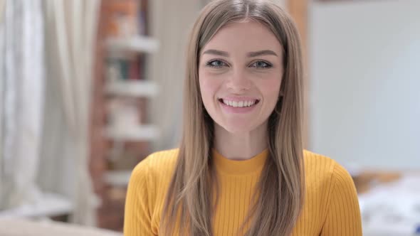 Portrait of Attractive Young Woman Smiling at the Camera