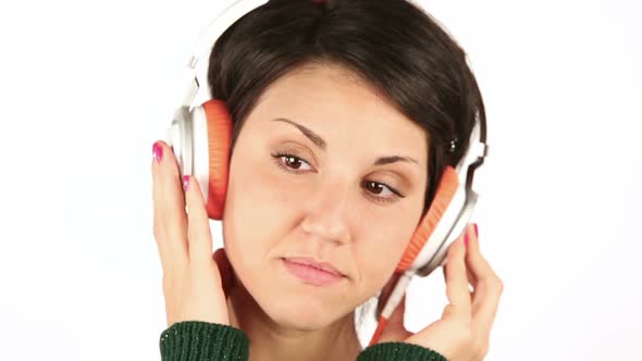 Sad Young Woman Listening Music with Headphones