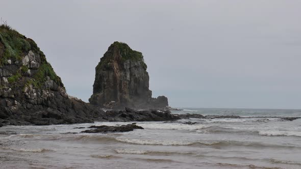 Strong wave hit the formation of rock near Cannibal Bay