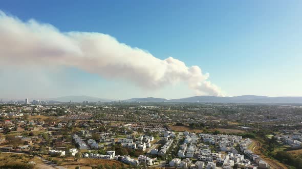 Fire behind the hills pollution smoke in nature danger