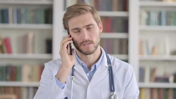 Portrait of Doctor Talking on Smartphone