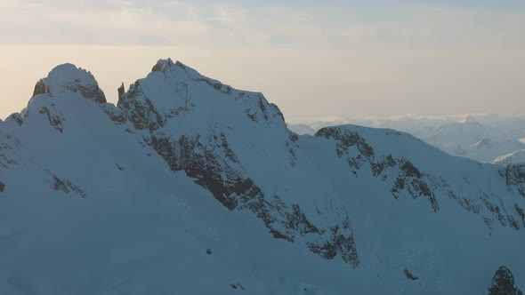 Aerial View From an Airplane of Beautiful Snowy Canadian Mountain Landscape