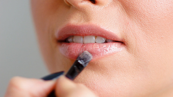 Makeup Artist Doing Lip Corrections on Woman 