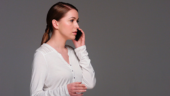 Caucasian Woman Talking Cell Phone While Isolated 