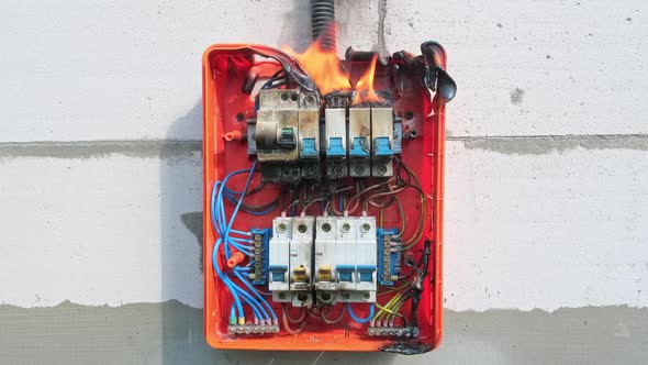 Burning Switchboard From Overload or Short Circuit on the Wall