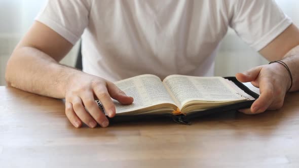 Sunday readings bible, a christian man reading the bible.